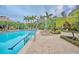 Inviting community pool with lounge chairs and umbrellas at 5208 Bouchard Cir # 201, Sarasota, FL 34238