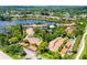 Wide aerial view of the condo community and its lush surroundings at 5369 Lake Arrowhead Trl # 17A, Sarasota, FL 34231