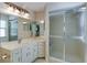Bright bathroom with corner vanity, large mirror, and a shower at 5369 Lake Arrowhead Trl # 17A, Sarasota, FL 34231