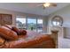 Main bedroom with lake view and large windows at 5369 Lake Arrowhead Trl # 17A, Sarasota, FL 34231