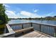 Wooden dock with a bench overlooking a serene lake at 5369 Lake Arrowhead Trl # 17A, Sarasota, FL 34231