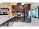 Kitchen boasts stainless steel appliances and dark wood cabinets at 5369 Lake Arrowhead Trl # 17A, Sarasota, FL 34231