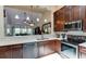 Modern kitchen with stainless steel appliances and dark wood cabinetry at 5369 Lake Arrowhead Trl # 17A, Sarasota, FL 34231