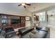 Spacious living room with a sectional sofa and an entertainment center at 5369 Lake Arrowhead Trl # 17A, Sarasota, FL 34231