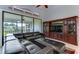 Living room features a large sectional sofa and an entertainment center at 5369 Lake Arrowhead Trl # 17A, Sarasota, FL 34231