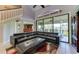 Living room with sectional sofa and access to a patio overlooking water at 5369 Lake Arrowhead Trl # 17A, Sarasota, FL 34231