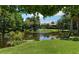 Peaceful pond view with a bench, providing a relaxing spot to enjoy the scenery at 5369 Lake Arrowhead Trl # 17A, Sarasota, FL 34231