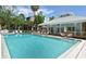 Inviting community pool with a cabana and plenty of lounge chairs at 5369 Lake Arrowhead Trl # 17A, Sarasota, FL 34231
