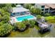 Community pool and deck area with canal views at 5369 Lake Arrowhead Trl # 17A, Sarasota, FL 34231