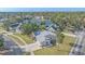 Aerial view of house and neighborhood, showcasing waterfront access at 5384 Sarapointe Ct, Sarasota, FL 34232