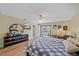 Spacious bedroom with laminate flooring and sliding door access to backyard at 5384 Sarapointe Ct, Sarasota, FL 34232