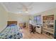 Well-lit bedroom with built-in workspace and ample storage at 5384 Sarapointe Ct, Sarasota, FL 34232