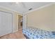 Small bedroom with a twin bed and access to the living area at 5384 Sarapointe Ct, Sarasota, FL 34232