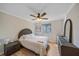 Charming bedroom with a queen-size bed and wood-look flooring at 5384 Sarapointe Ct, Sarasota, FL 34232