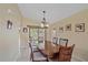 Dining room with wooden table and access to backyard at 5384 Sarapointe Ct, Sarasota, FL 34232