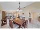 Bright dining room with a wooden table and kitchen view at 5384 Sarapointe Ct, Sarasota, FL 34232