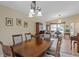 Dining room with a wooden table and chandelier at 5384 Sarapointe Ct, Sarasota, FL 34232