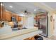 Modern kitchen featuring stainless steel appliances and ample wood cabinetry at 5384 Sarapointe Ct, Sarasota, FL 34232