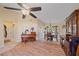 Living room with hardwood floors and a view to the dining area at 5384 Sarapointe Ct, Sarasota, FL 34232