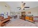 Spacious living room with hardwood floors, piano and wooden furniture at 5384 Sarapointe Ct, Sarasota, FL 34232