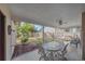 Relaxing screened patio overlooking a fenced backyard at 5384 Sarapointe Ct, Sarasota, FL 34232