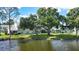 Backyard view of home with lake access at 5507 Fair Oaks St # 3-C, Bradenton, FL 34203