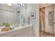 Clean bathroom with single sink vanity, tiled shower, and mirror at 5507 Fair Oaks St # 3-C, Bradenton, FL 34203