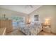 Spacious Primary bedroom with king-size bed and water view at 5507 Fair Oaks St # 3-C, Bradenton, FL 34203