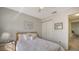 Charming bedroom with full-size bed, neutral decor, and double door closet at 5507 Fair Oaks St # 3-C, Bradenton, FL 34203