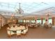 Large dining room with multiple tables and chairs at 5507 Fair Oaks St # 3-C, Bradenton, FL 34203