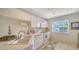 Kitchen with white cabinets, double sink and appliances at 5507 Fair Oaks St # 3-C, Bradenton, FL 34203