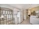 Kitchen with white cabinets and a wine rack at 5507 Fair Oaks St # 3-C, Bradenton, FL 34203