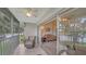 Spacious lanai with wicker furniture and lake view at 5507 Fair Oaks St # 3-C, Bradenton, FL 34203