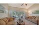 Living room with lake view and comfortable seating at 5507 Fair Oaks St # 3-C, Bradenton, FL 34203