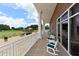 Relaxing patio with rocking chairs and golf course views at 5507 Fair Oaks St # 3-C, Bradenton, FL 34203