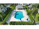 Community pool with plenty of lounge chairs at 5507 Fair Oaks St # 3-C, Bradenton, FL 34203