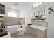 Spa-like bathroom with soaking tub and stylish design at 5906 Larchwood Ave, Sarasota, FL 34231