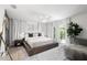 Comfortable bedroom with king-size bed and access to balcony at 5906 Larchwood Ave, Sarasota, FL 34231