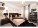 Spacious bedroom with a king-size bed and modern decor at 5906 Larchwood Ave, Sarasota, FL 34231