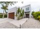 Modern two-story home with a contemporary design and attached garage at 5906 Larchwood Ave, Sarasota, FL 34231