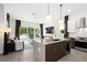 Modern kitchen with island, stainless steel appliances and open concept to the living area at 5906 Larchwood Ave, Sarasota, FL 34231