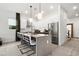 Contemporary kitchen boasts stainless steel appliances and a large island with seating at 5906 Larchwood Ave, Sarasota, FL 34231