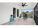 Relaxing screened balcony with rocking chair and view at 5906 Larchwood Ave, Sarasota, FL 34231