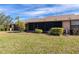 Backyard with screened enclosure and grass at 6135 Heritage Ln # 6135, Bradenton, FL 34209