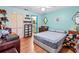 Bedroom with light blue walls and wood flooring at 6135 Heritage Ln # 6135, Bradenton, FL 34209
