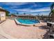 Community pool with brick patio and seating at 6135 Heritage Ln # 6135, Bradenton, FL 34209