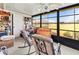 Bright sunroom with ample windows and rocking chairs at 6135 Heritage Ln # 6135, Bradenton, FL 34209