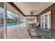 Inviting pool area with patio furniture under a covered patio at 6221 28Th E Ave, Bradenton, FL 34208