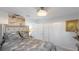 Guest bedroom with neutral decor and large closet at 6726 S Lockwood Ridge Rd, Sarasota, FL 34231