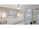 Main bedroom with plush bedding and ensuite bathroom access at 6726 S Lockwood Ridge Rd, Sarasota, FL 34231